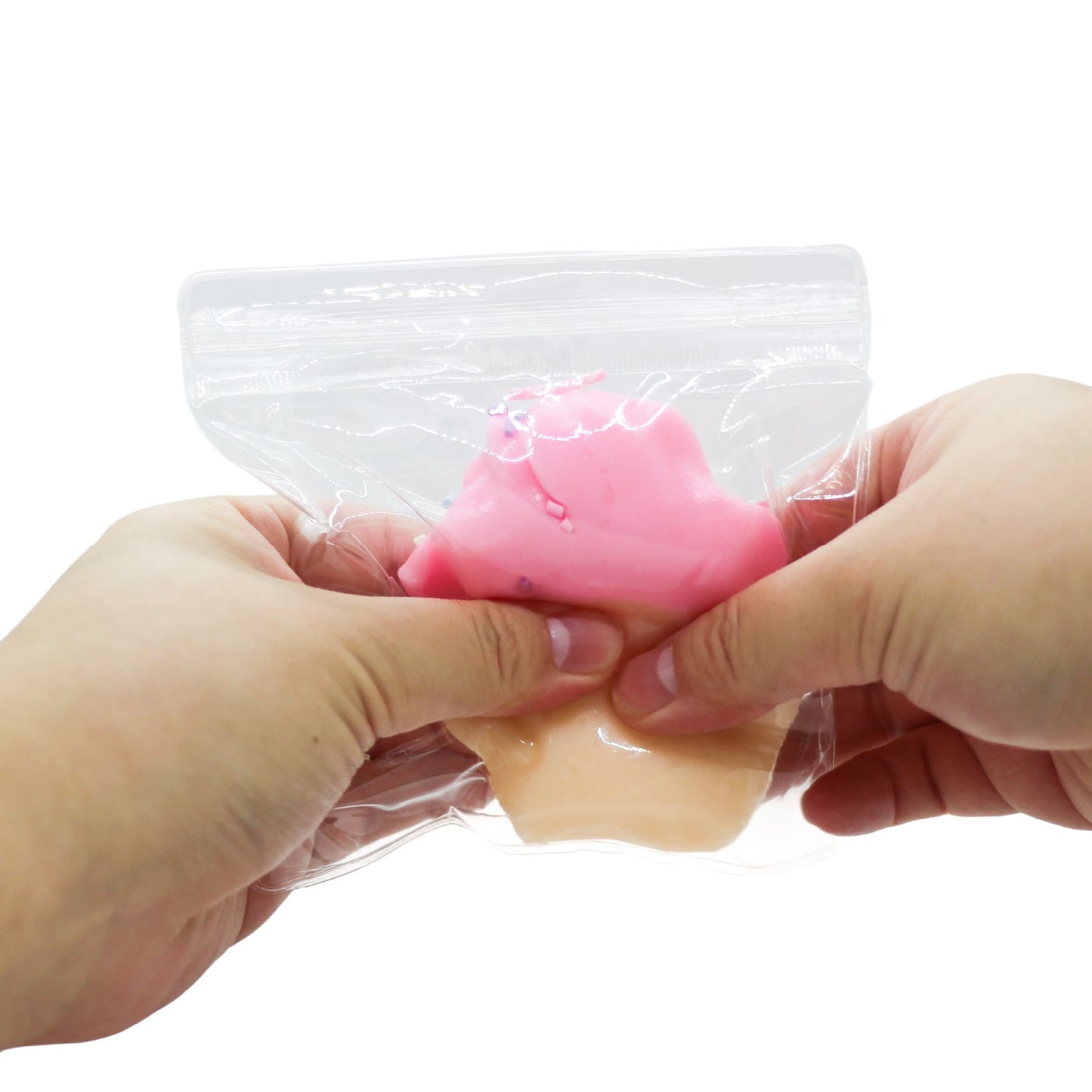 Pink SwirlyCone squishy toy being squeezed by hand