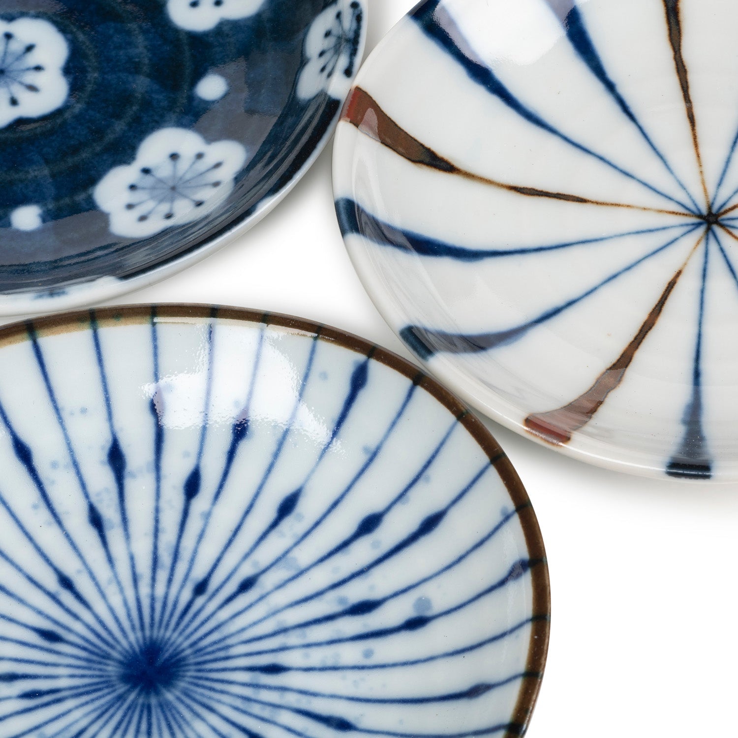 Close-up of Aizome indigo floral and radial mini plate patterns