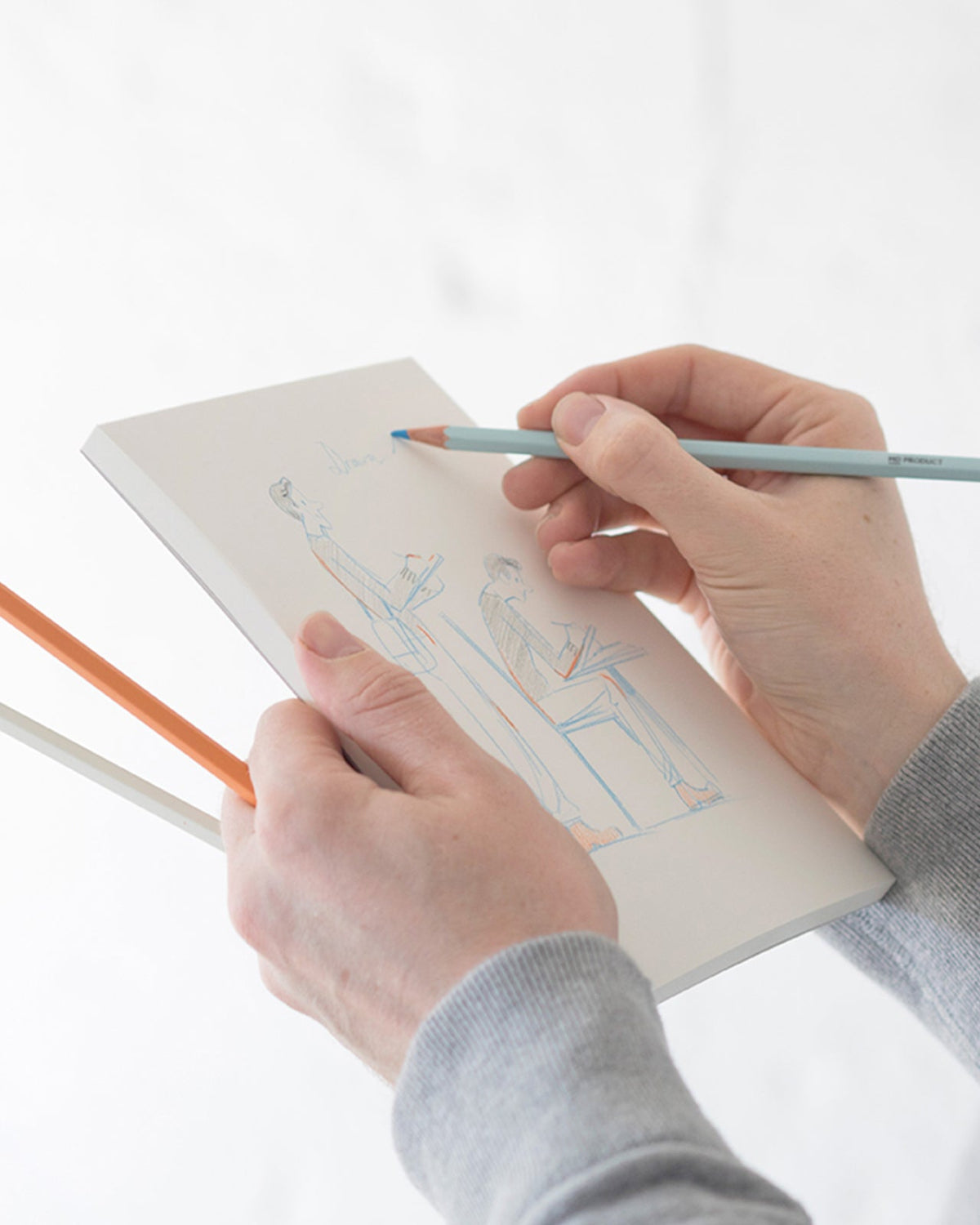 Light blue MD Colored Pencil being used in a sketchbook