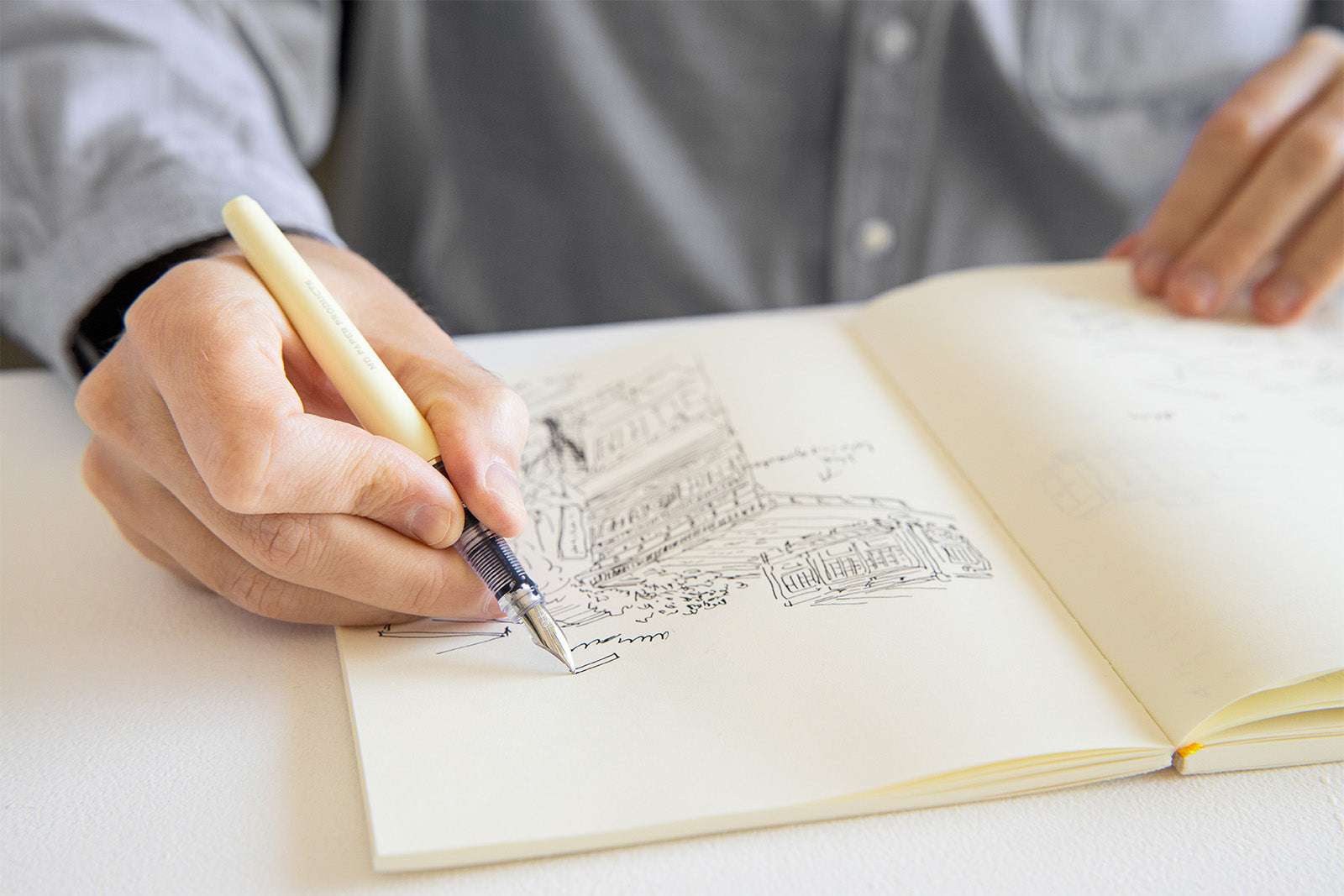 MD Fountain Pen being used for sketching in a notebook